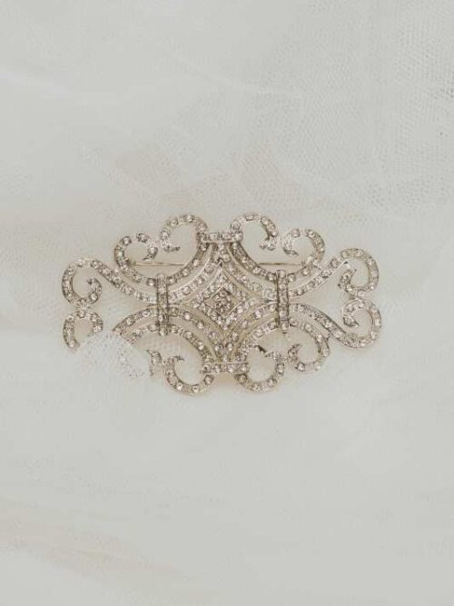 Broche mantillo rodio 8/4